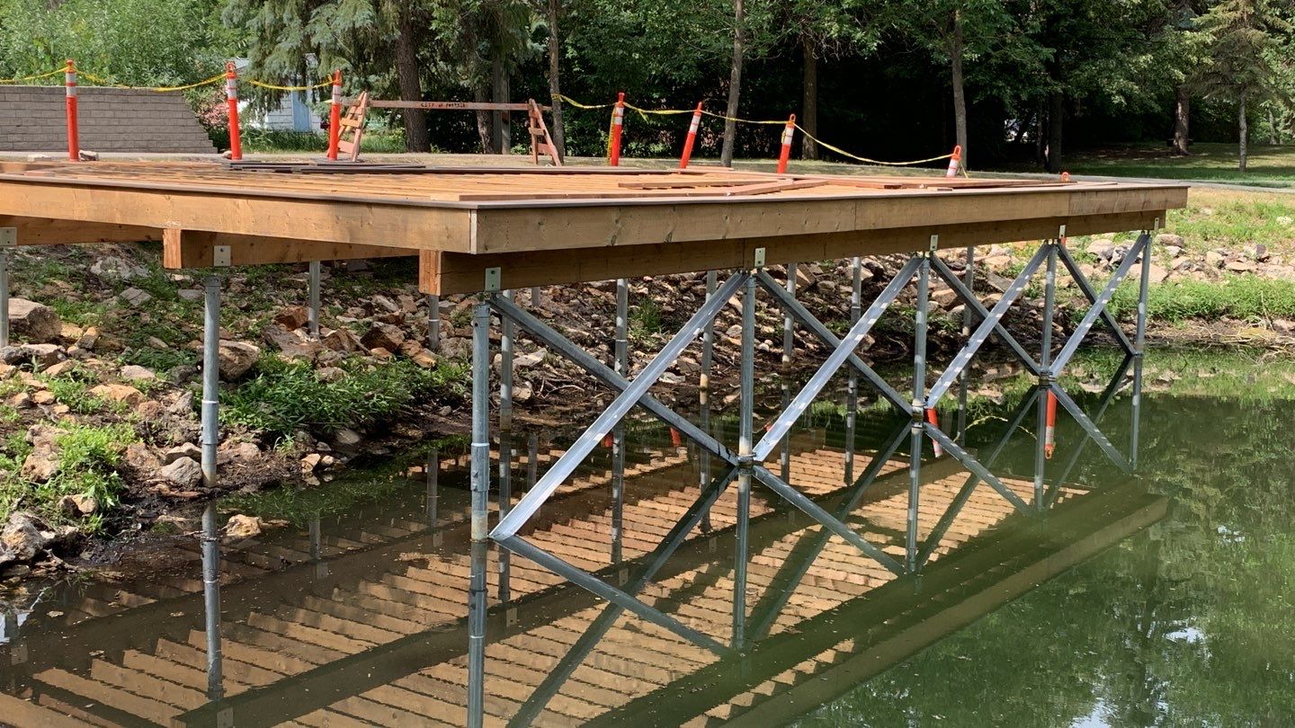 Pond deck on helical piles
